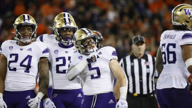 Oct 2, 2021; Corvallis, Oregon, USA; Washington Huskies running back Sean McGrew (5) celebrates with teammates after scoring a touchdown against the Oregon State Beavers during the second half at Reser Stadium. Mandatory Credit: Soobum Im-USA TODAY Sports